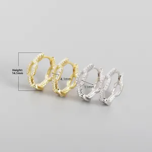 Macro shot of S925 sterling silver chain link hoop earrings with cubic zirconia stones