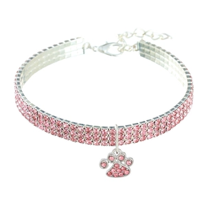Detail of pink rhinestone pet collar with adjustable chain and paw print pendant
