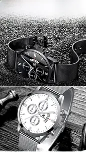 Detail of business quartz watches with stainless steel mesh band and calendar display