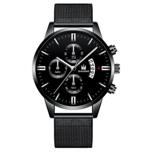 Detail view of the black SHAARMS quartz watch with a milanese mesh band and calendar