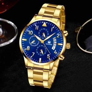 Detail of SHAARMS gold chronograph watch featuring a blue dial and precise date window