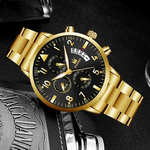 Close-up of gold metal watch strap and black chronograph dial on a leather wallet