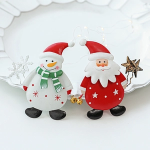 Festive metal Santa and Snowman Christmas bottle hanging ornaments on white background