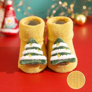 Toddler Christmas socks detail closeup, thickened loop-knit baby floor socks with cute trees.