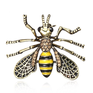 Detailed view of an alloy bee brooch with yellow black oil drip and sparkling crystals