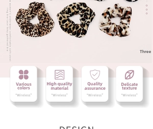 Detail of leopard print hair scrunchies set featuring soft leopard patterned fabric texture