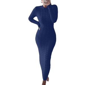 Close-up of navy blue cable knit texture on a long sleeve slim fit sweater dress