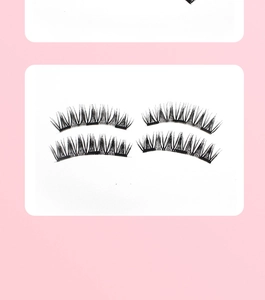Macro view of two pairs of natural cross-style black magnetic eyelashes on white card
