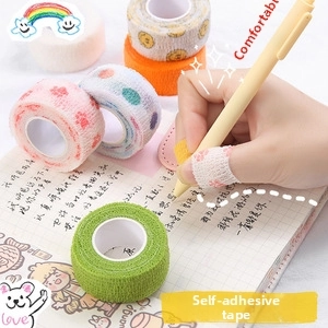 Macro shot of breathable elastic finger bandage with cute patterns for writing protection