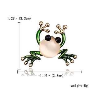 Detailed view of green enamel frog brooch with dimensions 3.3cm x 3.8cm and 8g weight
