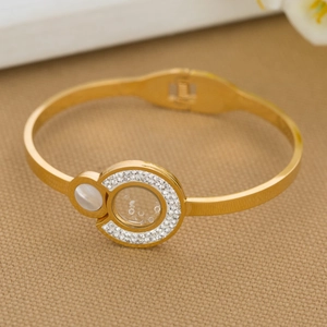 Polished 316L stainless steel gold bangle featuring white shell and crystal zircon inlay