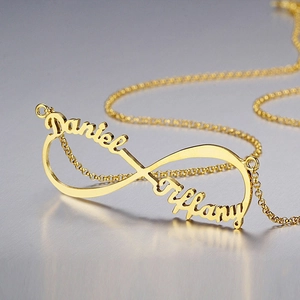 Custom infinity name necklace in gold with Daniel and Tiffany script engravings