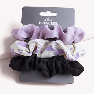 Set of 3 velvet and floral scrunchies in purple and black on a display card