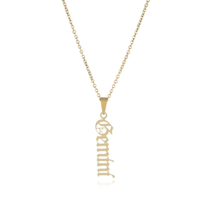 Detail of gold Gemini zodiac necklace with gothic font pendant on white background