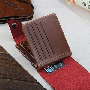 Close-up of brown leather trifold wallet with snap closure and UnionPay card slots