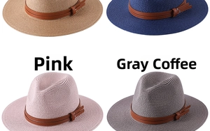 Close-up of woven straw fedora hats with leather bands and metal buckle details