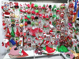 Close-up of retail display hooks with various colorful Christmas party headbands and hats