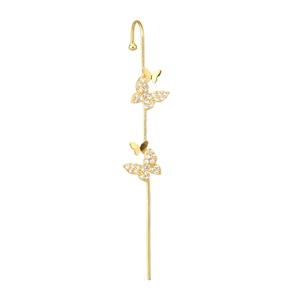 Close-up of gold butterfly ear cuff with sparkling zircon inlay and sleek metal finish