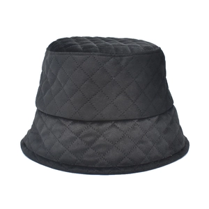 Quilted black velvet bucket hat with diamond lattice stitching for autumn and winter warmth