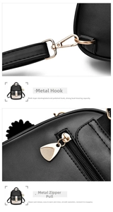 Detailed macro view of high-quality golden hardware buckle and zipper on black PU leather bag