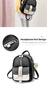 Detail view of mini backpack featuring quilted pattern, headphone jack and daisy charm