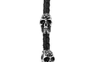 Detail of black braided leather strap with silver rose skull charm in punk style