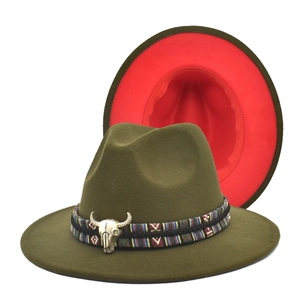 Detail of army green fedora with red lining, ethnic band and silver bull skull accessory