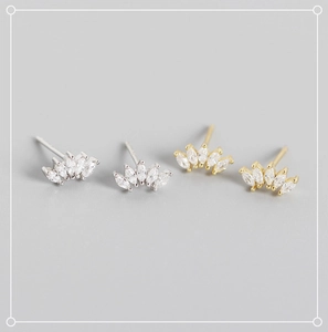 Detailed view of S925 sterling silver marquise cut stud earrings in gold and silver