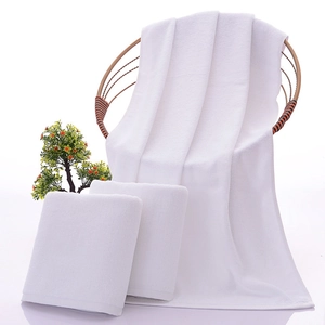 White high-quality 100% cotton hotel towel set with bath towel and face cloth on chair
