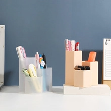 Three-layer frosted translucent and orange desktop organizer with stationery storage detail