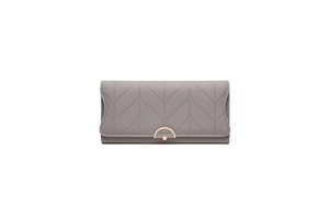 Macro detail of V-shaped quilted texture and gold semicircular buckle on gray PU wallet