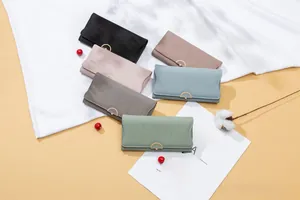 Detailed view of long PU leather wallets in six pastel colors with floral metal buckles