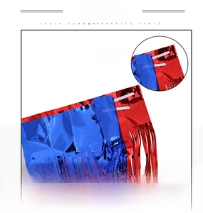 Detail of red and blue foil fringe curtains featuring self-adhesive backing for parties