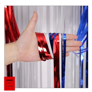 Detail of red, white and blue metallic foil fringe curtains for party decoration