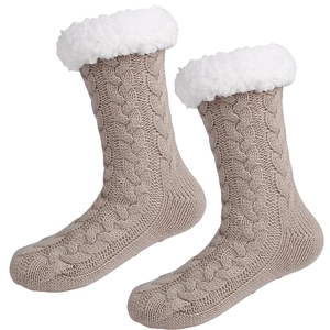 Detail of warm grey knit slipper socks with thick white plush lining and textured stitch