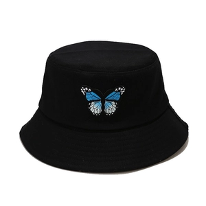 Minimalist black bucket hat for women with detailed blue butterfly embroidery on center