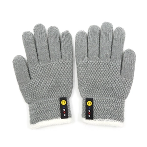 Grey knit winter gloves for kids featuring a yellow smiley face and BABY label detail