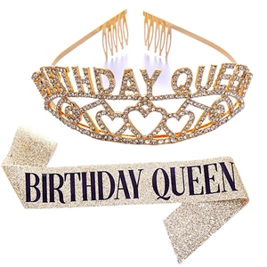Detail shot of sparkling golden Birthday Queen tiara and glitter sash party set