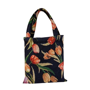 Vintage navy blue jacquard tote bag with orange tulip patterns and woven texture