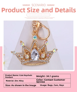 Close-up of golden crown keychain accessory with colorful rhinestones and drop-shaped crystal