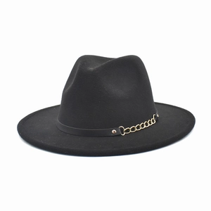 Close-up of black wool fedora featuring a decorative gold chain and leather belt band