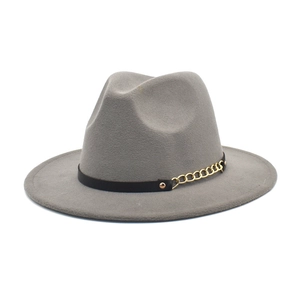 Detail of gray wool fedora hat featuring a black leather belt and gold chain buckle accent