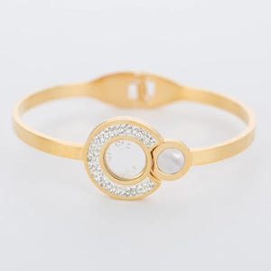 Close-up of 316L stainless steel bangle with pavé crystals and white shell inlay detail