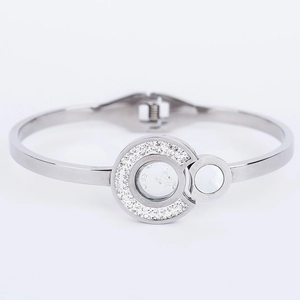 Detailed close-up of 316L stainless steel bangle featuring sparkling pave crystals and polished rings