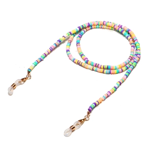 Detail of colorful polymer clay eyeglass chain with golden lobster clasps and silicone loops