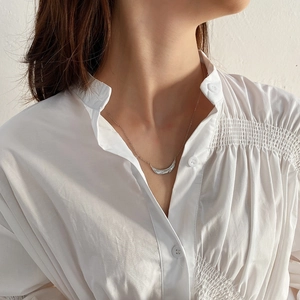 Close-up of S925 sterling silver leaf necklace with fine textured engraved patterns