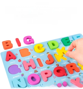 Detail of wooden alphabet puzzle with 3D colorful letters and animal illustrations