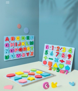 Detailed view of colorful wooden alphabet and number puzzle boards for early learning
