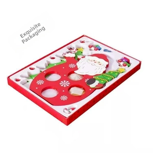 Detailed view of DIY Christmas wooden ornament craft kit with Santa Claus and festive tree