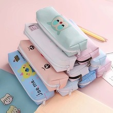 Detail of colorful cartoon canvas pencil cases with zippers and cute Korean stationary designs
